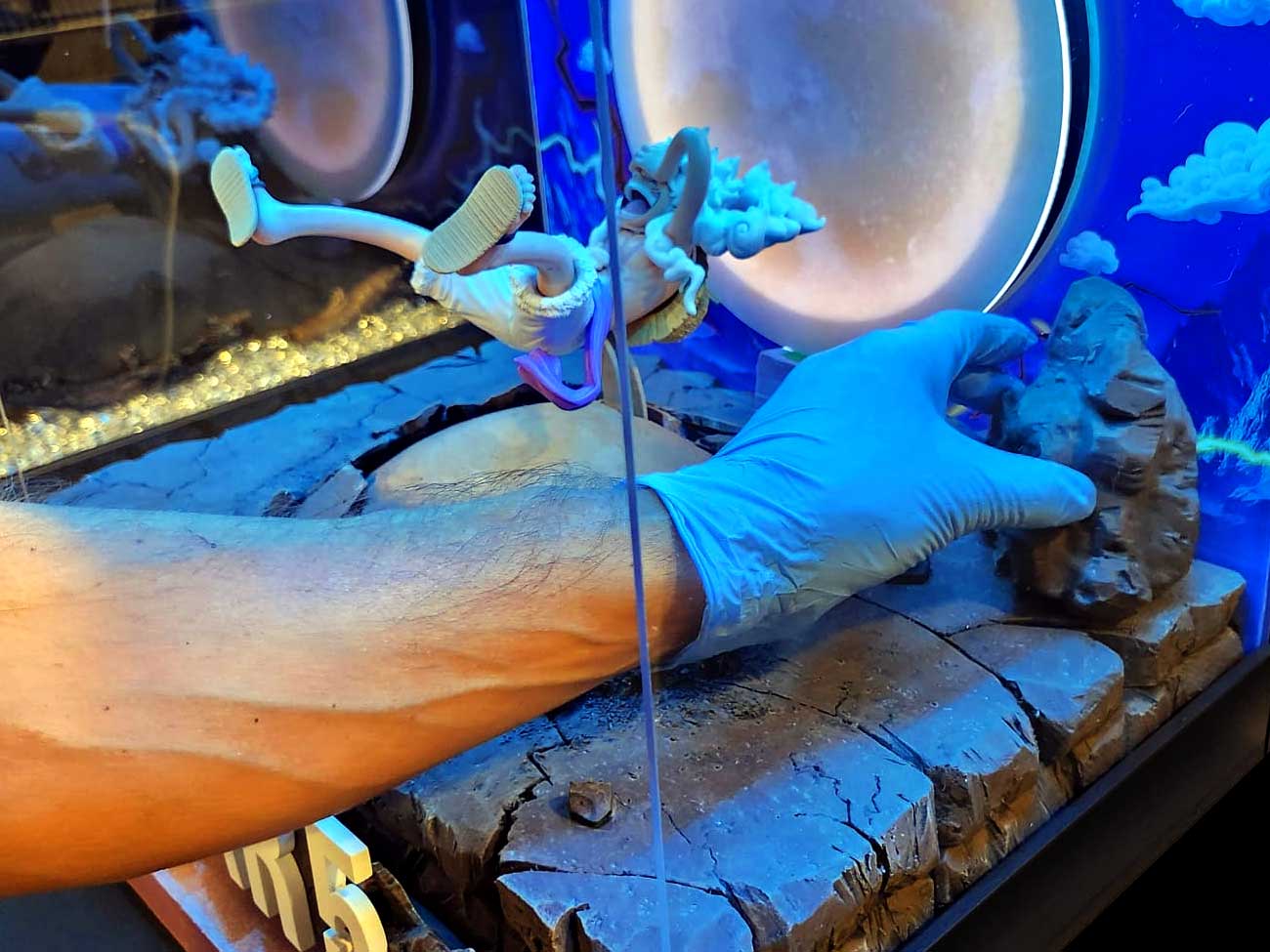 Bringing-Every-Element-Together11 Positioning handcrafted rock formations inside the Gear 5 custom diorama display.