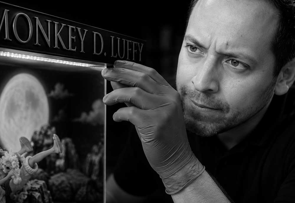 Artisan performing quality control on a handcrafted collectible display